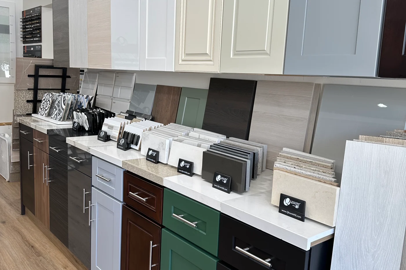 Cabinet door and countertop samples on display in the Kitchen By Design showroom